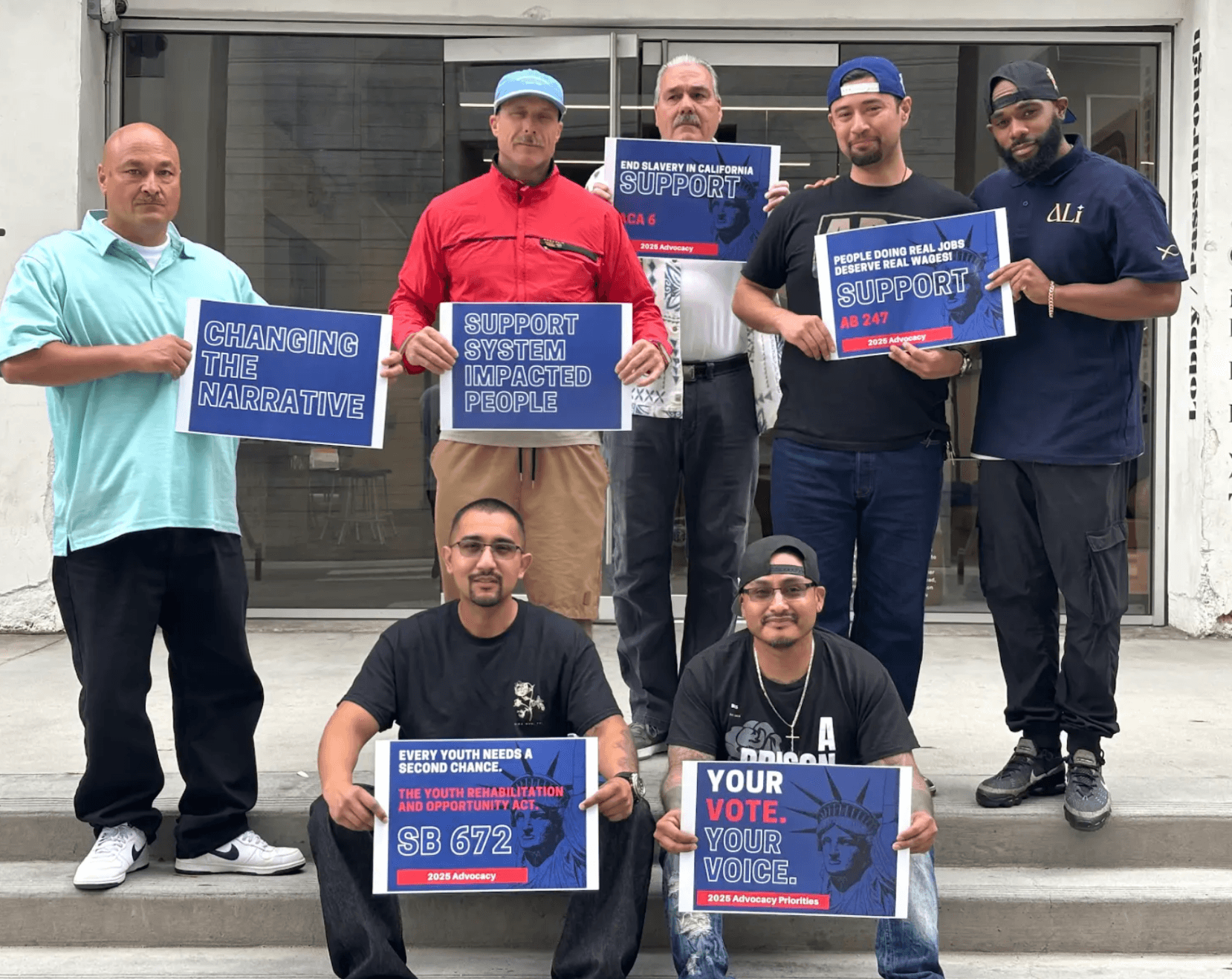 L.E.A.D. participants holding 2025 advocacy priority signs outside the ALI office